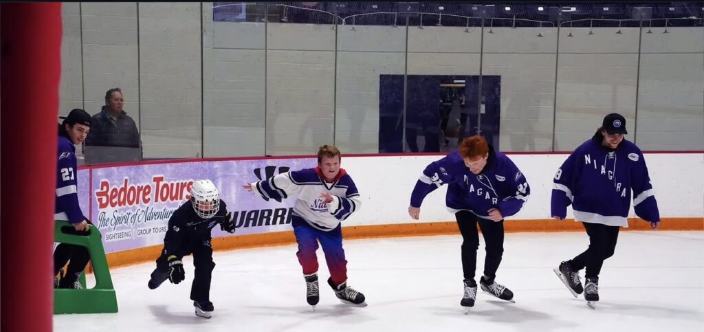 Nu Purple Eagle, and three Niagara Jr members having a skating race.